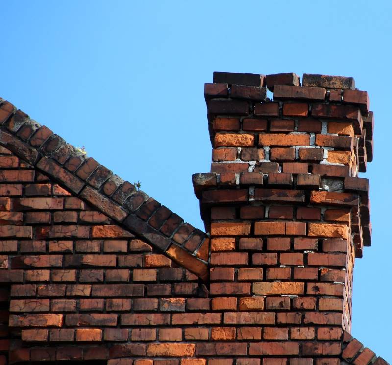 Signs Your Ferndale Home Needs a Chimney Inspection Damaged chimney on an Ferndale home showing cracks and missing mortar